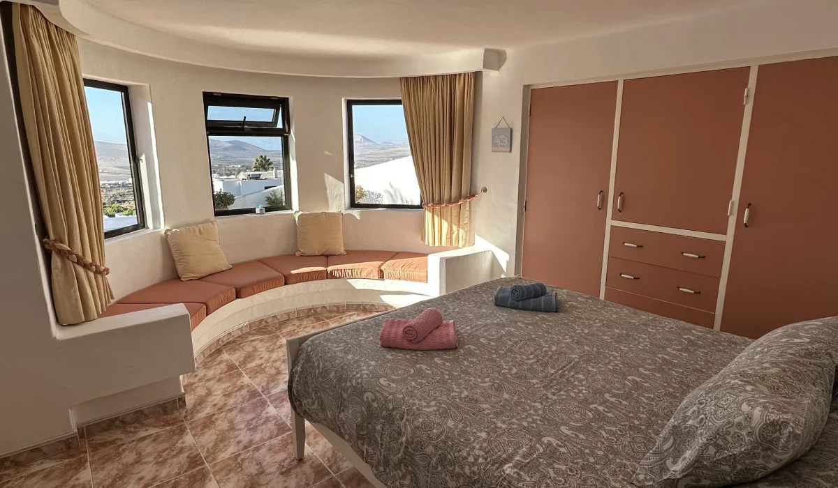 Bedroom 1 with window seat and view