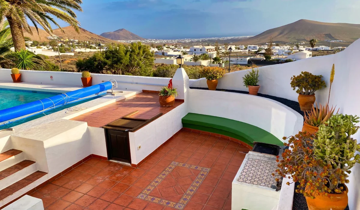 Sheltered sun terrace above the pool