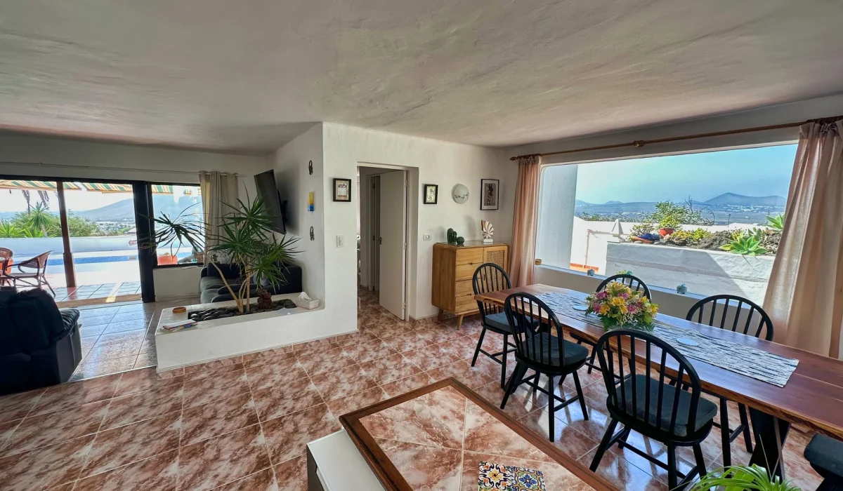 Open-plan living and dining area with views outside